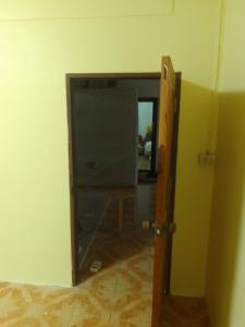 an open door to a room with a mirror at รีสอดเวล์ in Samutprakarn