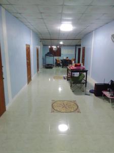 a hallway with a room with a rug on the floor at รีสอดเวล์ in Samutprakarn