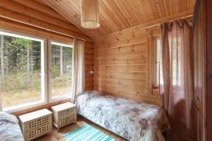 Postel nebo postele na pokoji v ubytování Toriko Village
