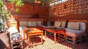 a living room with a couch and a table at Medina Oasis Hostel in Marrakesh