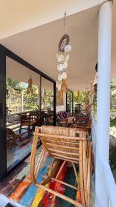 a living room with a bench on a rug at Casa Alexa - Island Escape in Puerto Princesa City