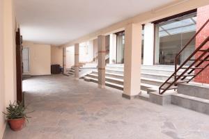 an empty hallway of a building with stairs at Jhigu Casa Homestay in Kirtipur