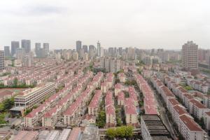 an aerial view of a large city with buildings at Shanghai Little 8 Apartment in Shanghai