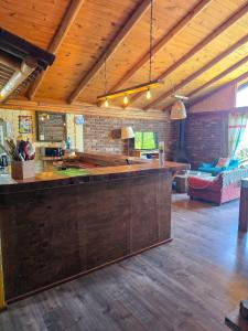 a large kitchen with a large counter in a room at Casa Amanecer Vichuquén in Vichuquén Lake +67 photos