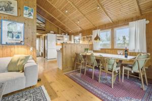 a kitchen and dining room with a table and chairs at 8116-Ega-Under-Ronnene-37 in Egå