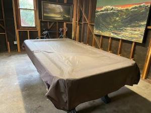a mattress in a room with a painting on the wall at Large Fenced Yard, Pool Table, Disney Central in Fullerton