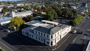 an aerial view of a large white building on a street at Park Hotel in Mount Gambier
