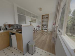 a kitchen and living room with a table and a window at Tamar Vista Retreat in Legana