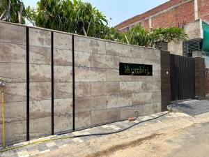 a concrete wall with a sign on it at Lumbini in Varanasi