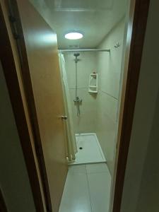 a small bathroom with a shower and a toilet at Vista Colonial, en el Residencial Riviera Colonial in Calero +24 photos