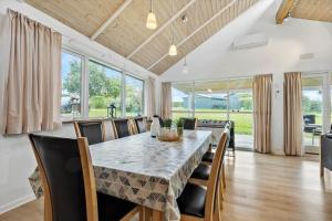 a dining room with a table and chairs at 84218-Ebeltoft-Koravej-21 in Ebeltoft