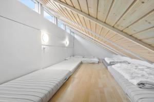 an attic room with two beds in it at 84218-Ebeltoft-Koravej-21 in Ebeltoft