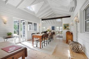 a dining room with a table and chairs at 8242-Knebel-Uraniavej-5 in Knebel