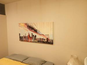 a painting of a city on a wall at Lima Centro Guest House Barrios in Lima