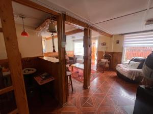 a living room with a couch and a table at Morada Austral in Punta Arenas