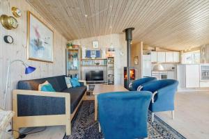 a living room with a couch and a table at 84266-Knebel-Toplaerkevej-1 in Knebel