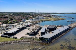 an aerial view of a marina with boats in the water at 84281-Ebeltoft-Hvide-Hus-Vej-3 in Ebeltoft