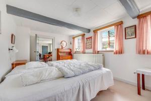 a bedroom with a large white bed in a room at 30580-Odder-Grindsnabevej-31 in Odder