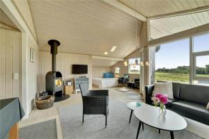 a living room with a couch and a table at 30727-Odder-Alrovej-203-A in Odder