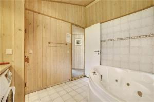 a bathroom with a white tub and a shower at 30727-Odder-Alrovej-203-A in Odder +22 photos