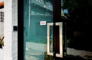 a door with a sign that says exit on it at Early Bird Hostel Ayutthaya in Phra Nakhon Si Ayutthaya