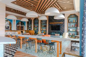 a dining room with a large table and chairs at The City Escape| Studio Apt w/ Skyline Views in Cincinnati