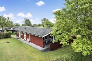 an aerial view of a red house with a yard at 30457-Odder-Snekkeager-20 in Odder