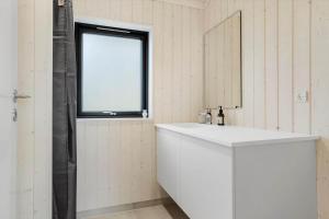 a white bathroom with a sink and a window at 30319-Odder-Grindevej-19 in Odder +26 photos