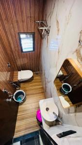 a bathroom with a sink and a toilet at Hotel U Life Residency Mumbai in Mumbai +69 photos