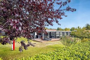 a house with a garden and a tree at 30355-Odder-Granvej-14 in Odder