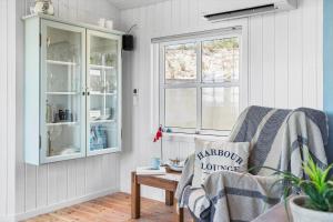 a living room with a chair and a window at 30594-Odder-Toldvejen-45-H in Odder