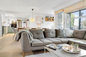 a living room with a couch and a table at 40162-Juelsminde-Gludvej-9 in Juelsminde