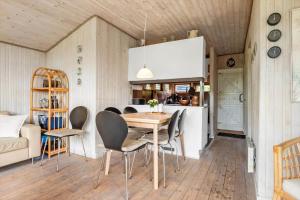 a kitchen and dining room with a table and chairs at 30401-Odder-Stakket-Torn-12 in Odder +18 photos