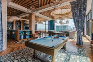 a pool table in a living room with a ceiling at Stylish 1 Bed In Downtown Cincinnati in Cincinnati