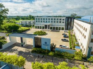 an aerial view of a building with a parking lot at Savan Resorts in Savannakhet