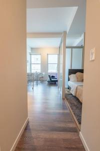 a bedroom with a bed and a living room at Stylish 1 Bed In Downtown Cincinnati in Cincinnati +55 photos