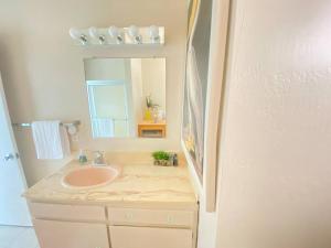 a bathroom with a sink and a mirror at Sea View, Boards, Bikes, Wd in Oxnard