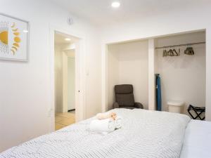 a bedroom with a bed with a teddy bear on it at Private 1BR w Yard & King Bed Simi Valley in Simi Valley
