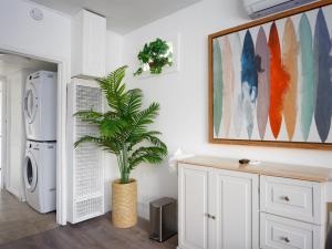 a laundry room with a plant in a vase at Private 1BR w Yard & King Bed Simi Valley in Simi Valley