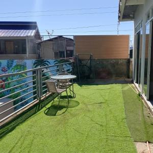a small patio with a table on a balcony at M3 Haven Masbate in Masbate