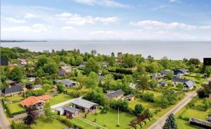 an aerial view of a neighborhood with houses and the water at 30536-Odder-Strandagervej-3 in Odder +20 photos
