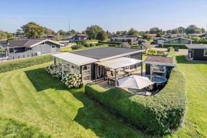 an overhead view of a house in a field at 40606-Juelsminde-Pilevaenget-24 in Juelsminde