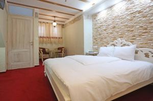 Voodi või voodid majutusasutuse Hotel Lula toas