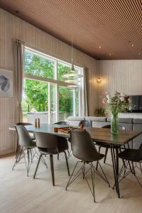a dining room with a table and chairs at 30356-Odder-Hougaardsvej-36 in Odder