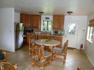 
A kitchen or kitchenette at Hale Nanea - Hana Paradise Cottages
