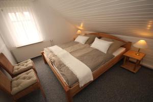 Postel nebo postele na pokoji v ubytování Nordsee Haus An't Oll Deep