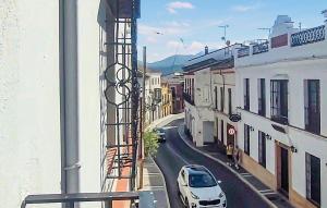 a view from a window of a street with a car at Casa Del Arco in Ronda +20 photos