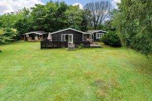 a large yard with a house in the background at 1608-Melby-Elna-Lassensvej-10 in Melby
