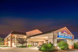 a bahworth inn and suites sign in front of a building at Baymont by Wyndham Topeka in Topeka