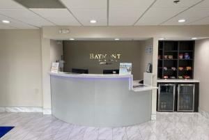 a lobby with a bar with the words baby mt on it at Baymont by Wyndham Topeka in Topeka